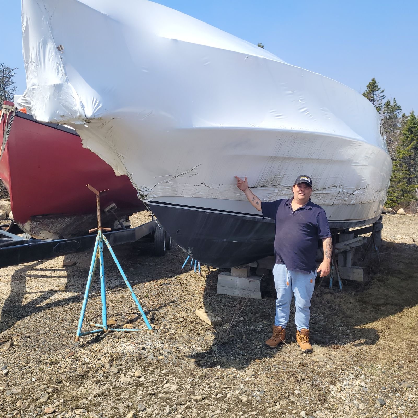 The Chris-Craft shrink-wrapped on stands